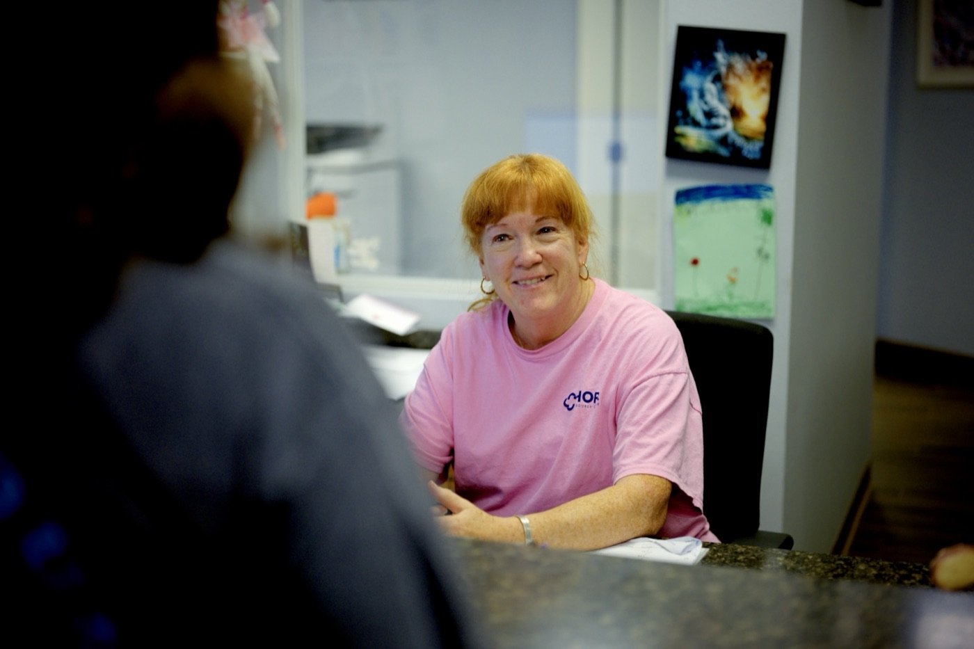 A Hope Resource Center staff member at the front desk