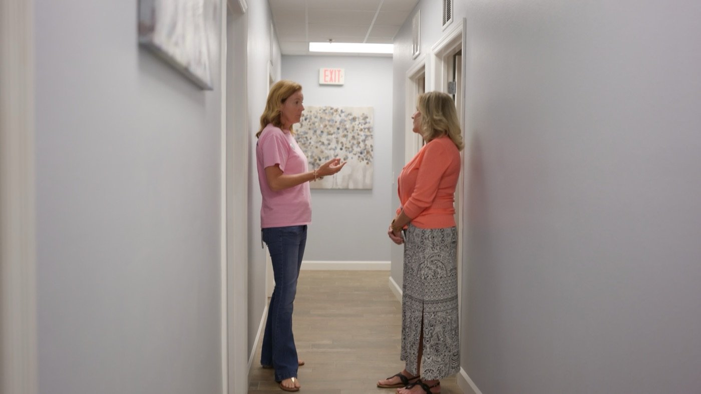 Two Hope Resource Center staff members in a one-on-one mentoring conversation
