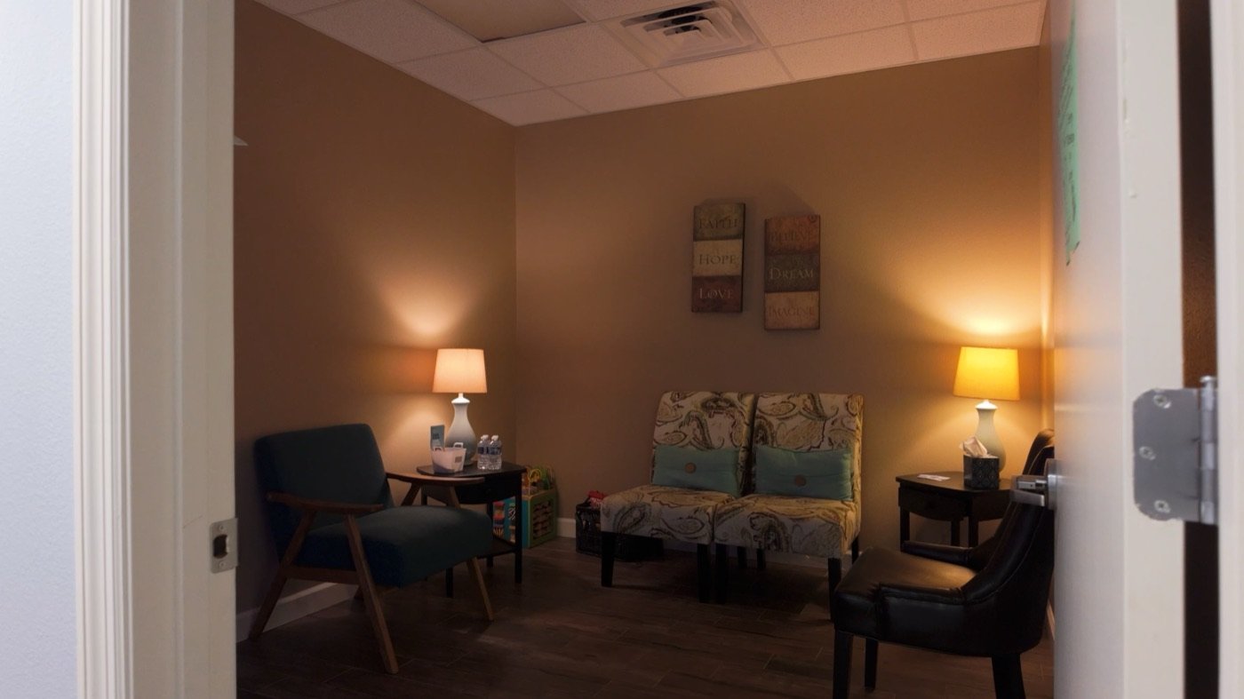 A calm, softly-lit sitting room at Hope Resource Center