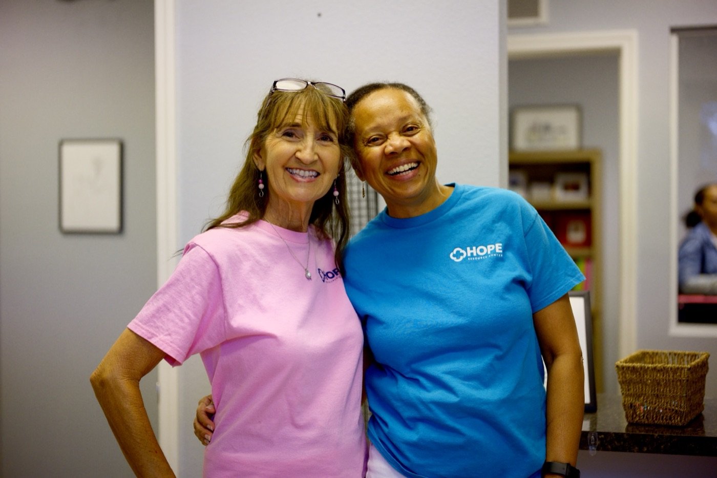Two Hope Resource Center volunteers smiling together